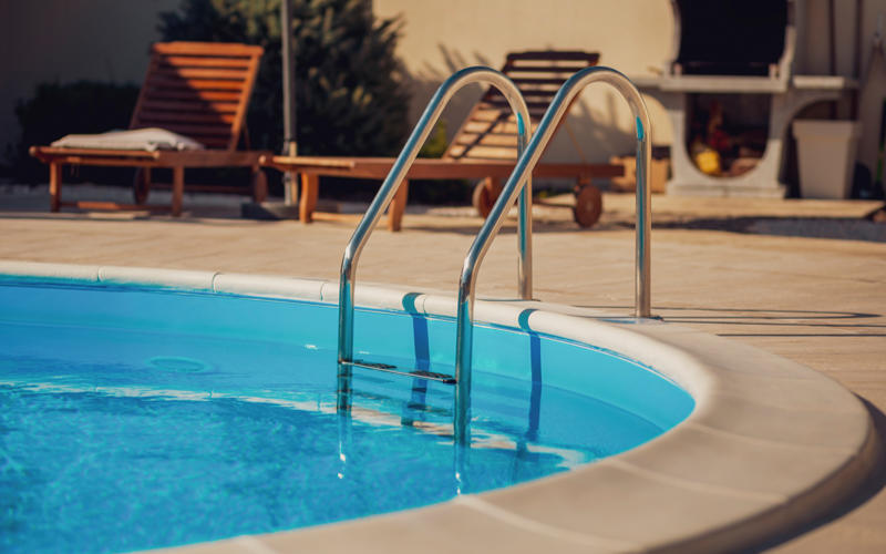 Empty outdoor swimming pool on a sunny summer day