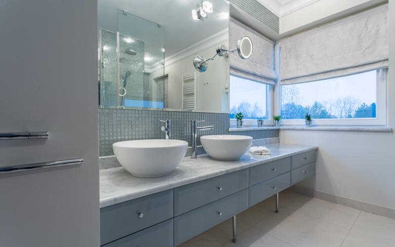 Modern bathroom interior with two sinks and window