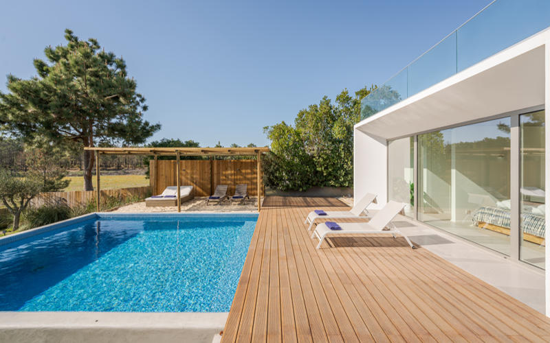Modern villa with pool and deck with interior and exterior views
