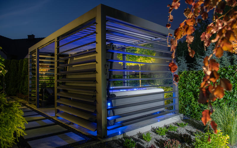 Aluminium Made Gazebo with Hot Tub Inside a Modern Garden. Small Architecture Elements.