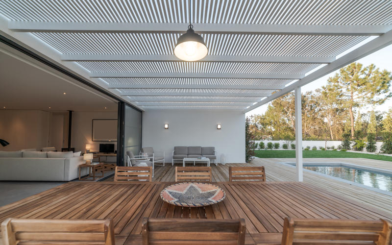 Modern house with garden swimming pool and wooden deck